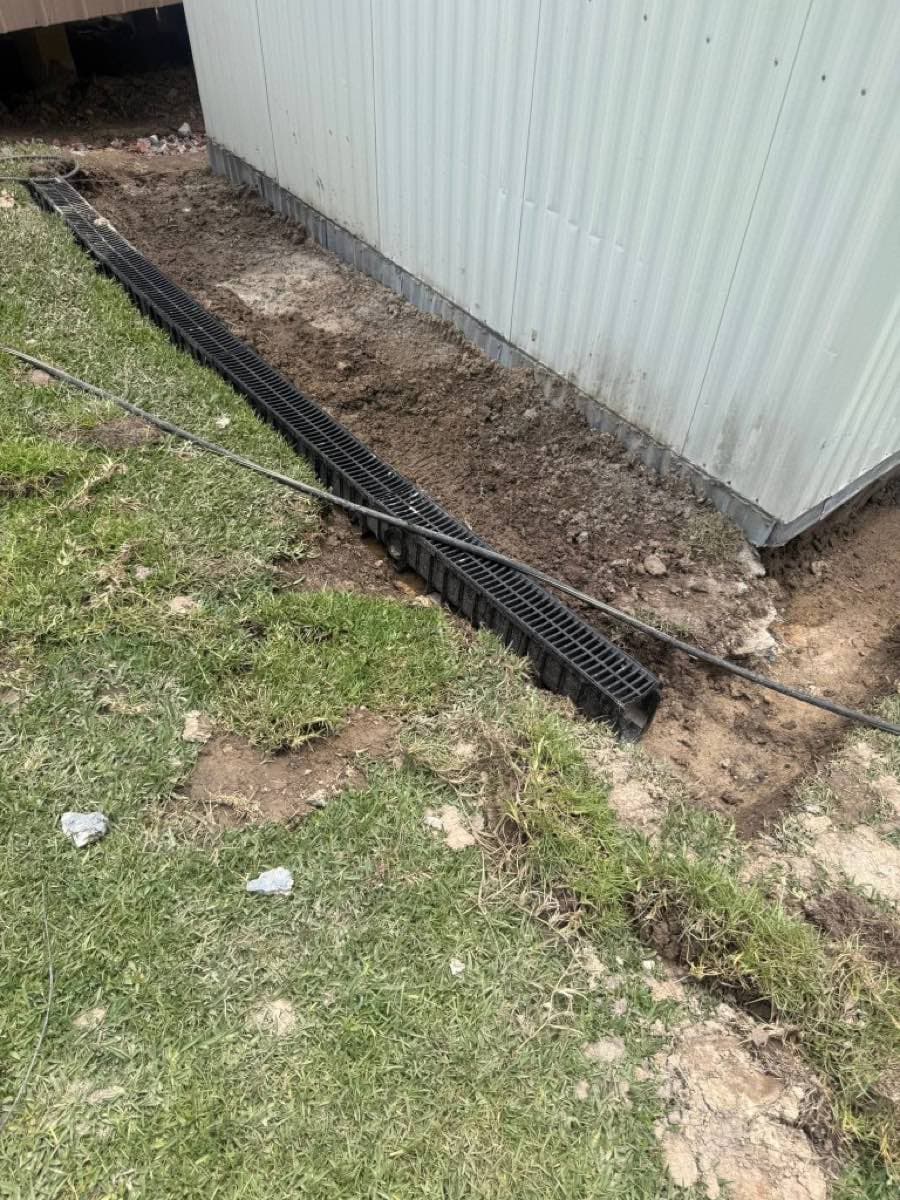 Residential trench drain installation for exterior water management in Monroe, LA